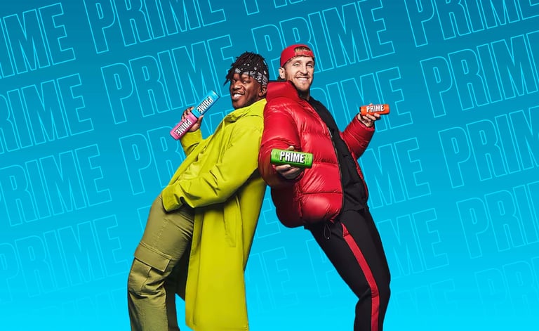Logan Paul and KSI leaning against each other with Prime in their hands