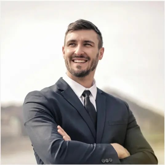man in a suit arms crossed