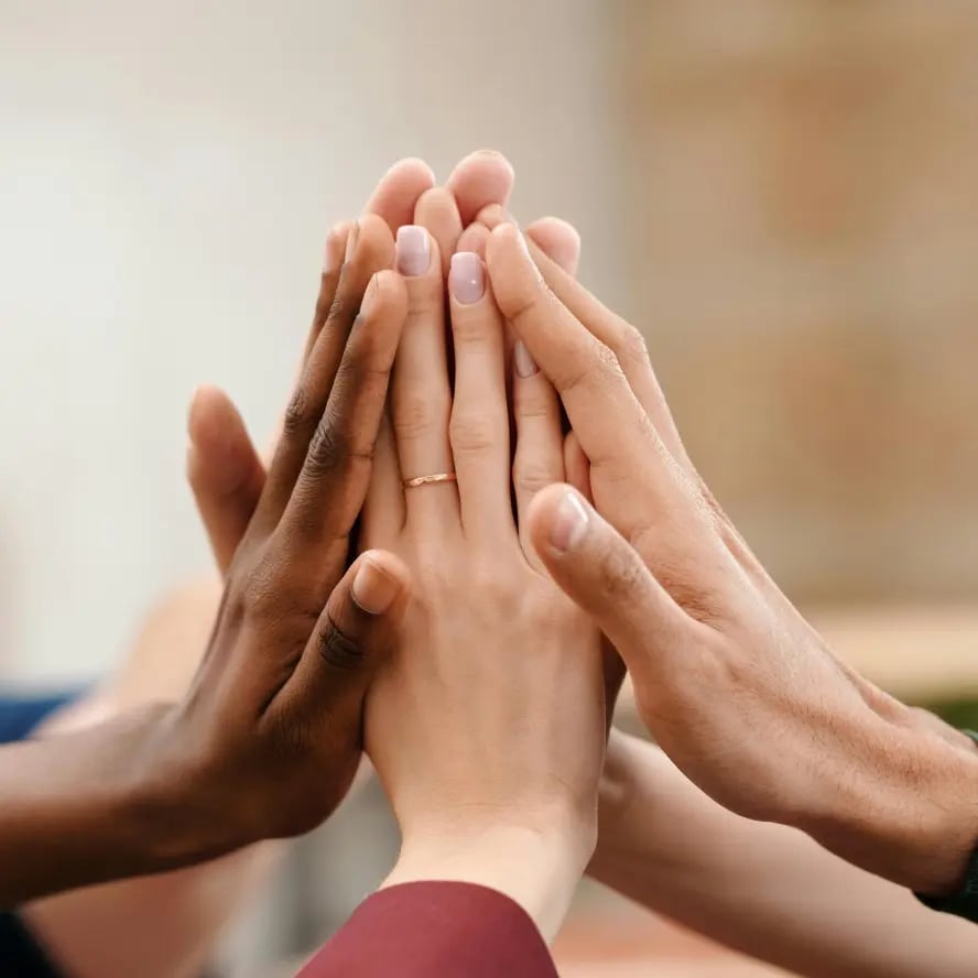 team high fiving each other